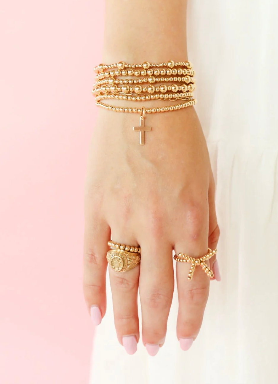 GOLD CROSS BEADED BRACELET